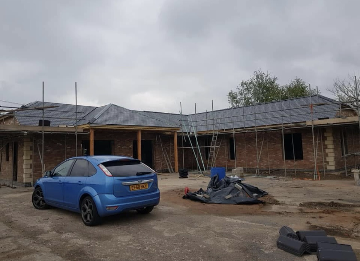 White UPVC fascia and soffit boards fitted along a roof edge